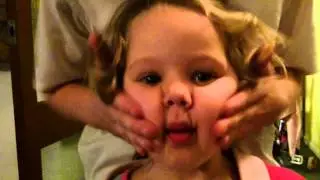 Extreme child face massage on little girl