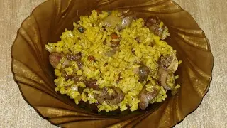 Рис с куриными сердцами и жареными овощами.