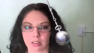 Beautiful brunette hypnotized by a pocketwatch