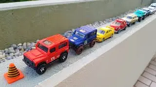 Driving cars by hand on the balcony wall 'Small Cars'