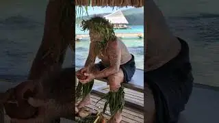 Squeezing coconut milk out of ground coconut in Le Tahaa resort