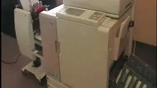 Thompson T-100D Envelope Feeder on Riso 7050R ComColor