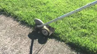 Edging a lawn with a stick edger