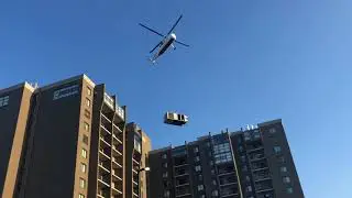 Reliable Heating & Air's Commercial HVAC Installation on a Skyscraper via Helicopter