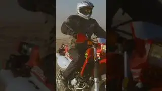 Frontal Tracking Shot of a Biker in the Desert
