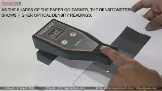 DENS V DENSITOMETER ON BLACK AND WHITE PAPER