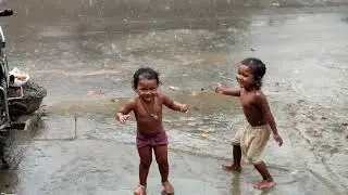 child taking bath in the rain