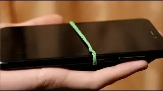 A simple magic trick with a rubber band and a viewer's phone. Tutorial.