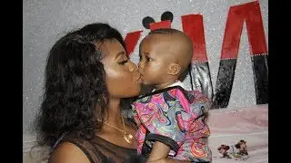 Mother Kisses Son Passionately                         on first bithday 