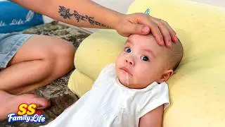 Baby Kim spat out milk while her dad was teaching her to sit