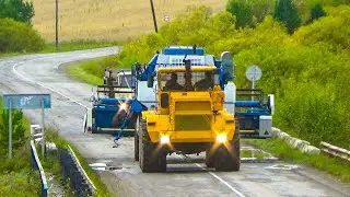 Evacuation of the Yenisei-950 combine from the field by a Kirovets K-701 on a rigid hitch.