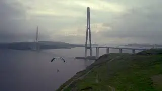 Russian island bridge and paraglider