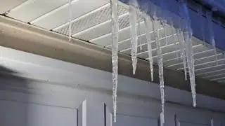 Considerate man takes time out of day to smash irky icicles || WooGlobe