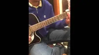 Omar playing guitar