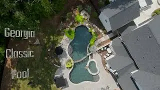 Double-Pool Design with Rock Waterfalls and Elevated Hot Tub | Experiencing Luxury