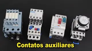 What are auxiliary contacts in electrical controls?