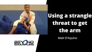 Juji Gatame: Using a strangle threat to release the arm
