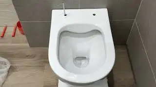 Installing a Grohe flush button and a Rostriks CHROME wall-hung toilet with concealed fastening