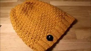 A simple beanie hat knitted on straight needles.