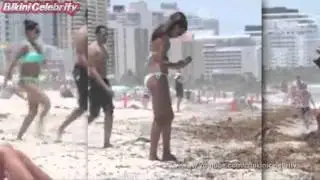 Claudia Jordan toned body wearing a turquoise string bikini in Miami. Jul 2015 [Paparazzi Video]