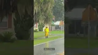 Crossing Guard Braves the Elements as Downpour Slams Central Florida