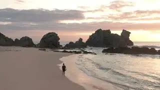 A Man Walking on a Beach During Sunset | Creative Commons Video
