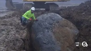 Crew unearths prehistoric glacial boulder