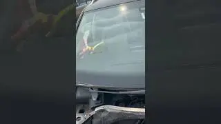 Cleaning a junkyard windshield 