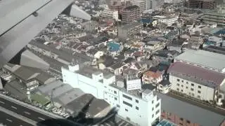 Airplane and its shadow. Landing on Osaka (Itami) Airport