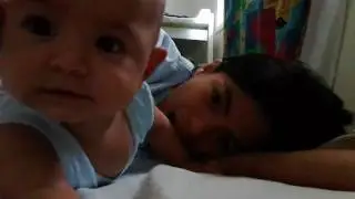 Baby playing with reflection
