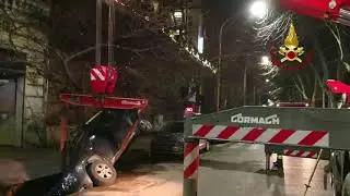 Vehicles removed after sinkhole swallows car on street in Rome