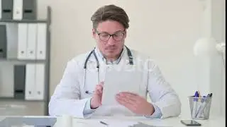 Middle Aged Male Doctor Using Digital Tablet | Stock Footage - Envato elements