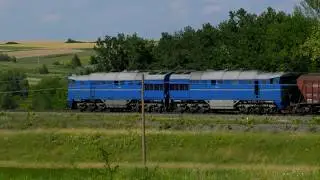 An endlessly long, hypnotic train meanders through the valley
