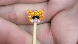 Амигуруми тигра из бисера, размером с бусинку