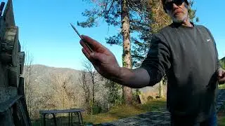 Throwing nails. 1 spin pinch grip, no-spin palm grip.