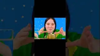 девушка ест золотые конфеты, пьет золотой кофе, а затем запивает это водой