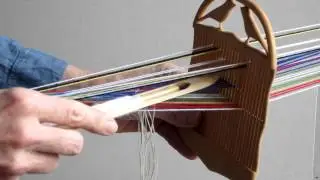 Weaving narrow bands with a double holed heddle