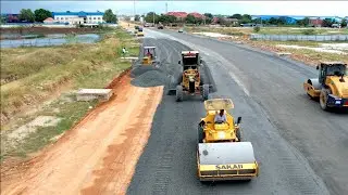 Amazing Showing Komatsu Dozer Motor Grader Spreading Gravel And Roller Compactor On New Road