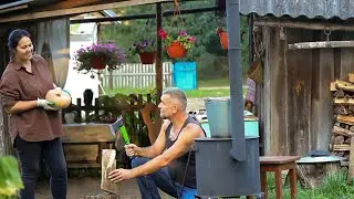 Village life in Belarus. Cooking roast on the fire. Unsettled life in the village
