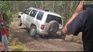 4x4 Isuzu Trooper, muddy uphill, big wheel lifts