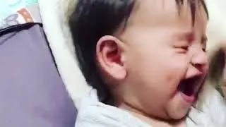 Baby girl hysterically laughing