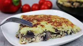 Potato casserole with chicken and mushrooms in a frying pan. Cooking lunch or dinner
