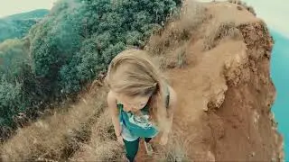 Couple Walks the Edge of Na’Pali Cliffs