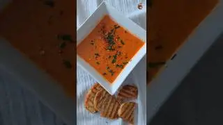 GRILLED  BELL PEPPERS TOMATO SOUP WITH COCONUT CREAM AND TOASTED BAGUETTE. VEGAN.