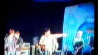 Nick Hitting himself with the microphone