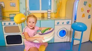Nastya plays at the funny playhouse of Peppa toy Theme Park