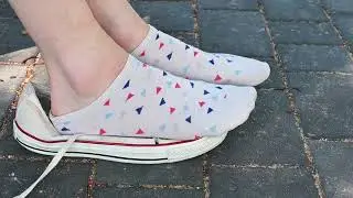 In socks and sneakers