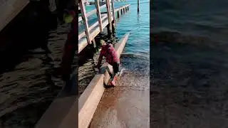 Why did he even put on boots? November in New Jersey. Still hot ocean. American lifestyle
