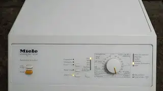 Miele Novotronic W 149 washing machine. The drum is jammed. We need to replace the crosspiece.