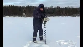 Ice drill and motor drill from a chainsaw Calm with their hands.